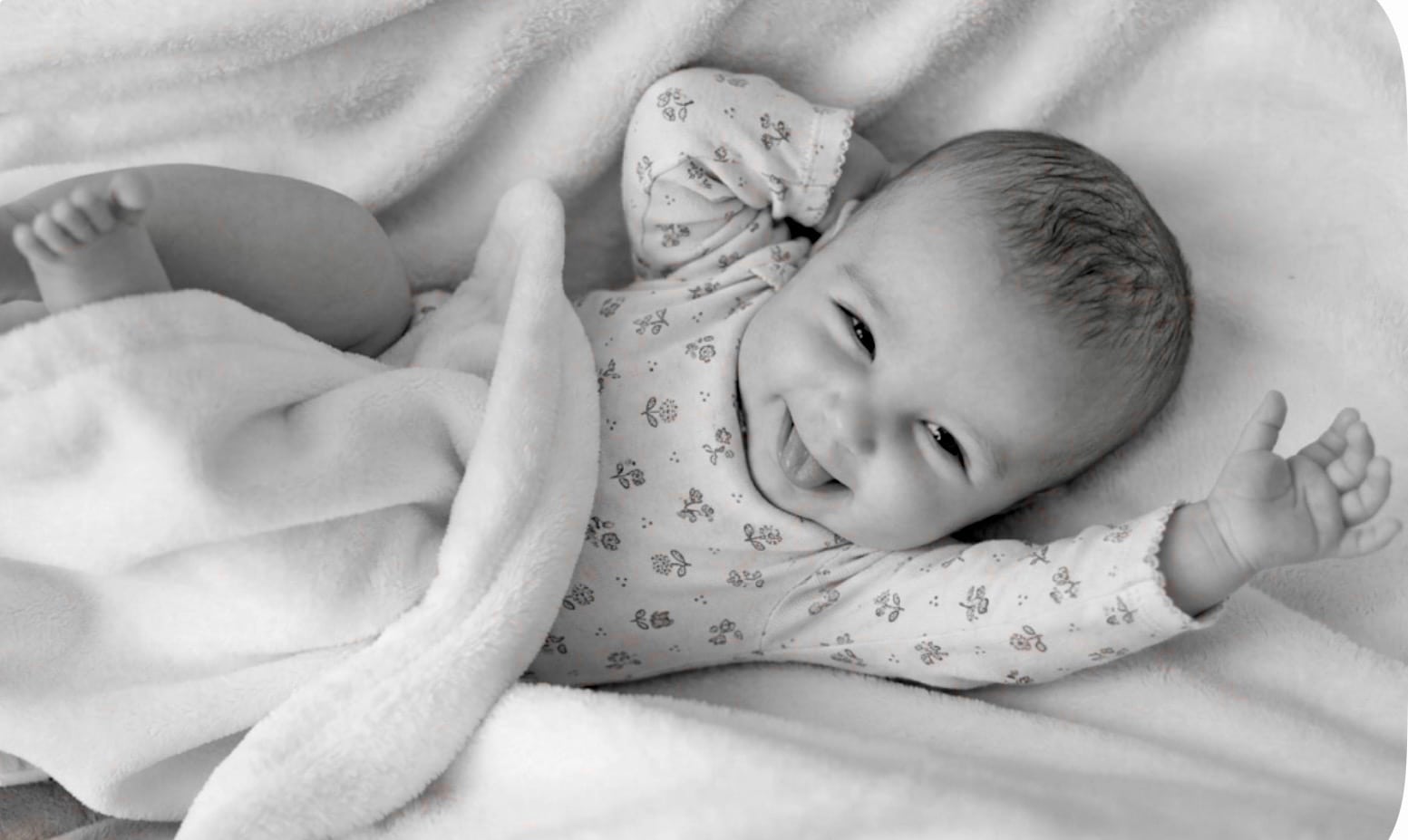 Newborn Baby Care, smalling baby on the bad.