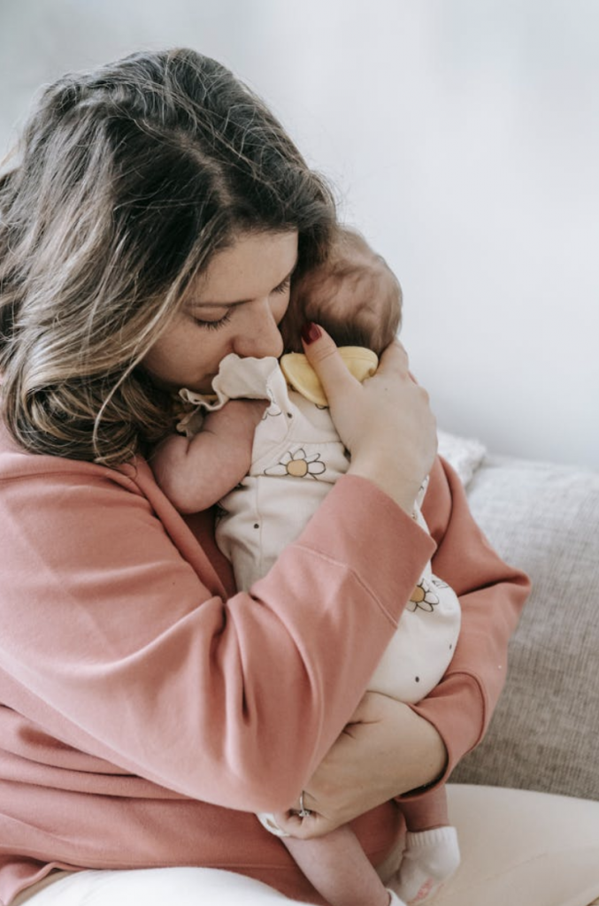 How to Navigate Identity Crisis as New Mom.  motherhood identity struggle.
New mother navigating identity crisis while reflecting on personal transformation.